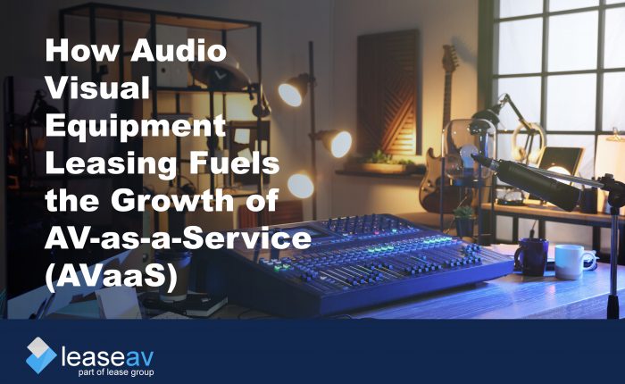 Audio mix deck on a desk with additional equipment to illustrate the benefits of audio visual equipment leasing and financing