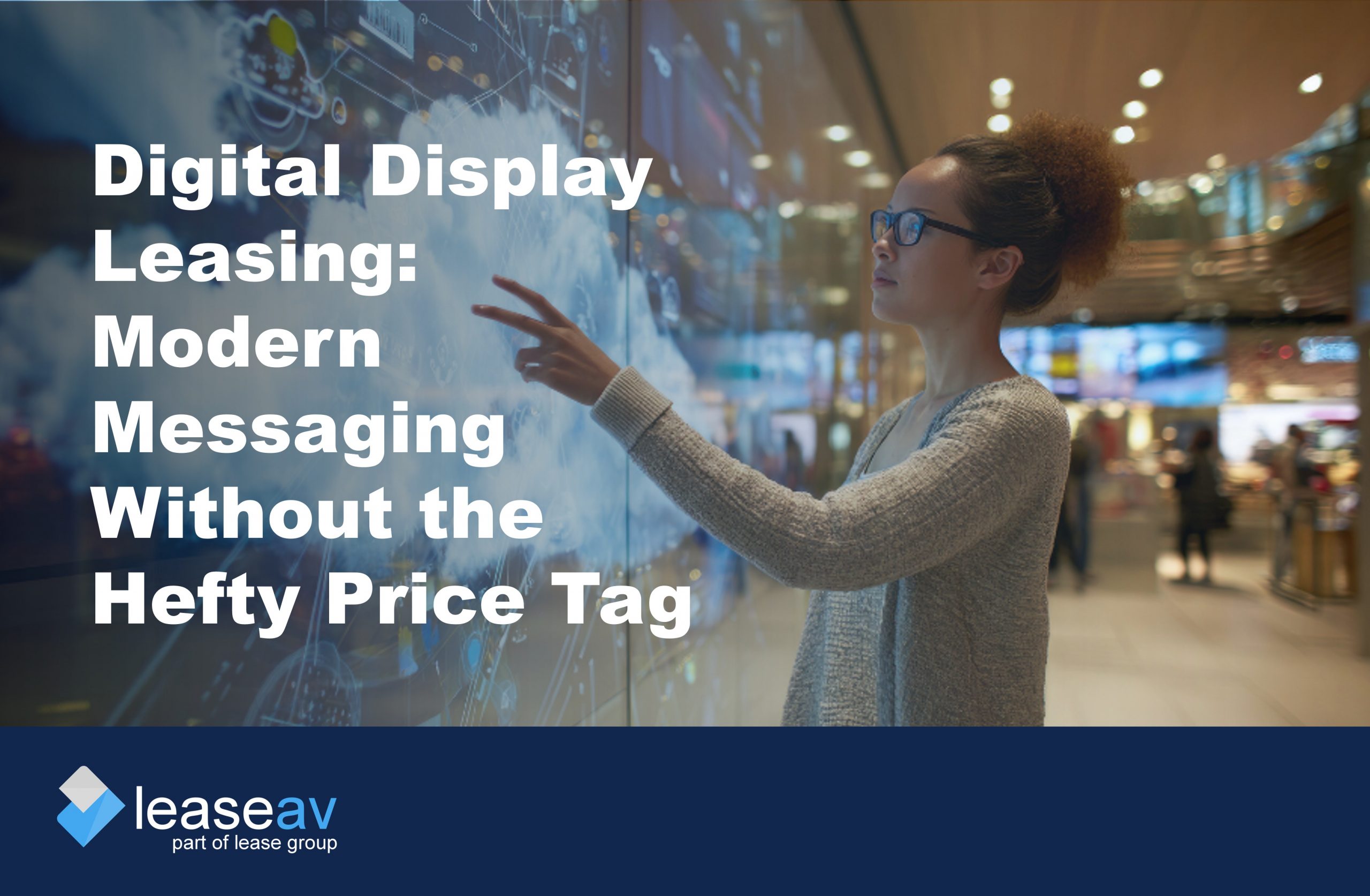 Image of woman touching interactive digital display screen to illustrate the benefits of digital display leasing